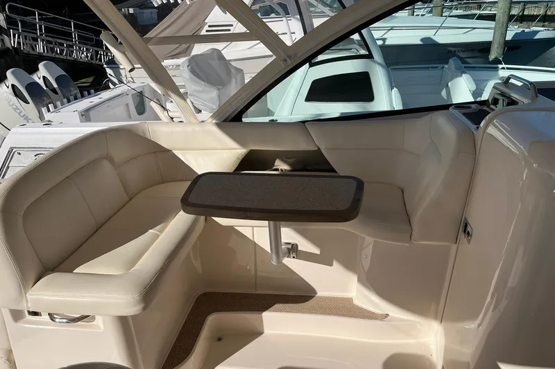  Yacht Photos Pics 2015 Grady-White Freedom 375 boat interior with beige seating and table.