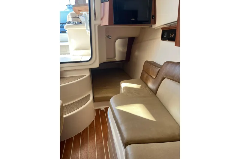  Yacht Photos Pics Interior of 2015 Grady-White Freedom 375 boat with seating and TV.