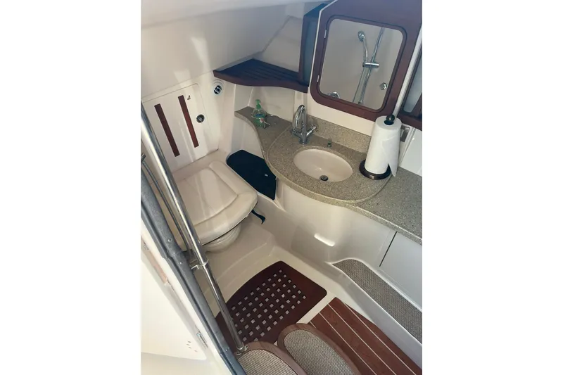 Yacht Photos Pics 2015 Grady-White Freedom 375 boat bathroom with sink, toilet, and mirror.