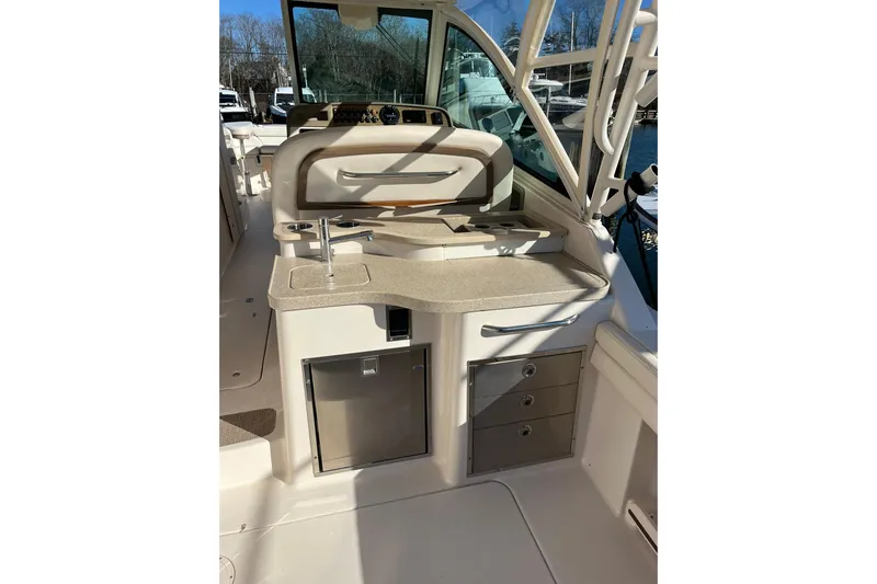  Yacht Photos Pics 2015 Grady-White Freedom 375 boat interior with sink and storage drawers.