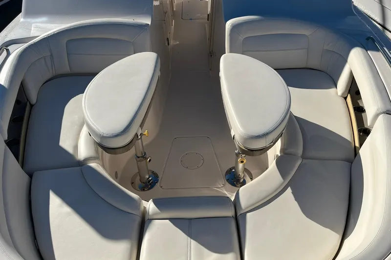  Yacht Photos Pics 2015 Grady-White Freedom 375 boat interior with cushioned seating and dual tables.