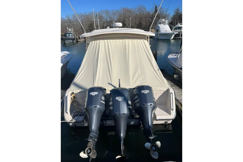  Yacht Photos Pics 2015 Grady-White Freedom 375 boat with triple Yamaha 350 engines docked at marina.