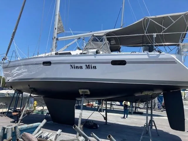 Nina Mia Yacht Photos Pics 2018 Catalina 385 sailboat "Nina Mia" on dry dock, showcasing sleek design and structure.