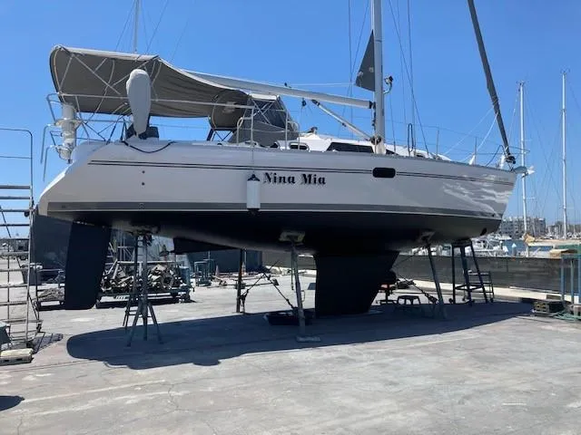 Nina Mia Yacht Photos Pics 2018 Catalina 385 sailboat "Nina Mia" on dry dock, marina background.