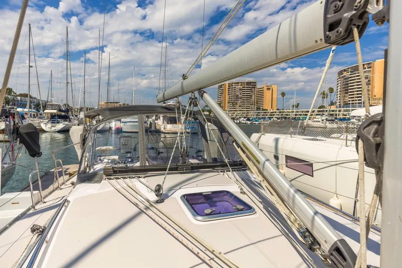 Nina Mia Yacht Photos Pics 2018 Catalina 385 sailboat docked in marina with cityscape background.