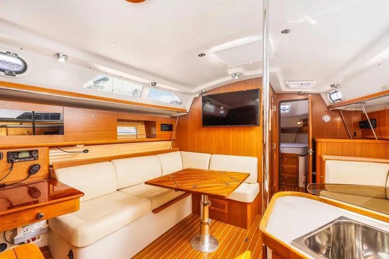 Nina Mia Yacht Photos Pics Luxurious interior of 2018 Catalina 385 yacht with modern amenities and elegant wood finishes.