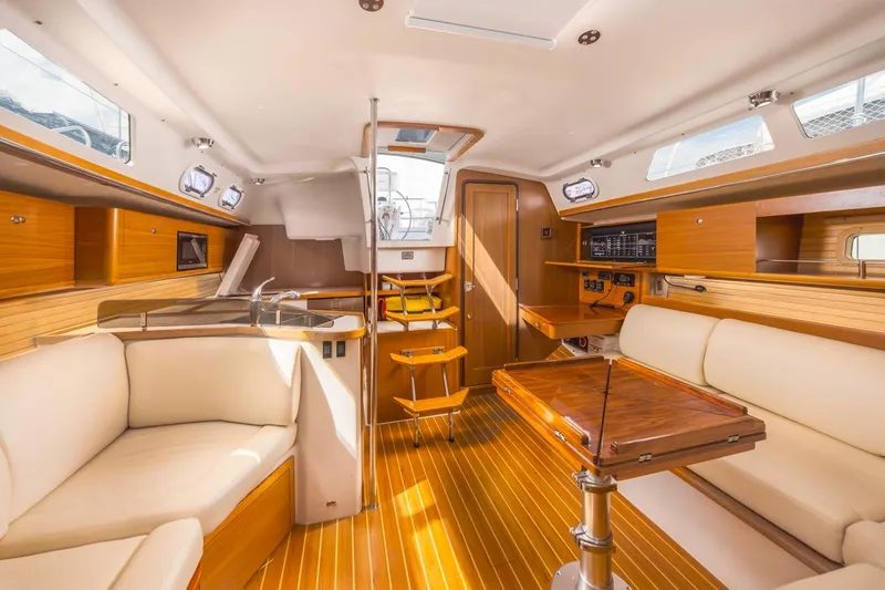 Nina Mia Yacht Photos Pics Interior of 2018 Catalina 385 sailboat with wooden finishes and comfortable seating.