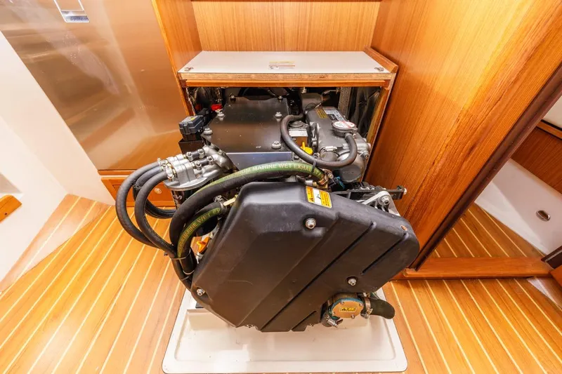 Nina Mia Yacht Photos Pics Engine compartment of a 2018 Catalina 385 sailboat, showcasing detailed mechanical components.