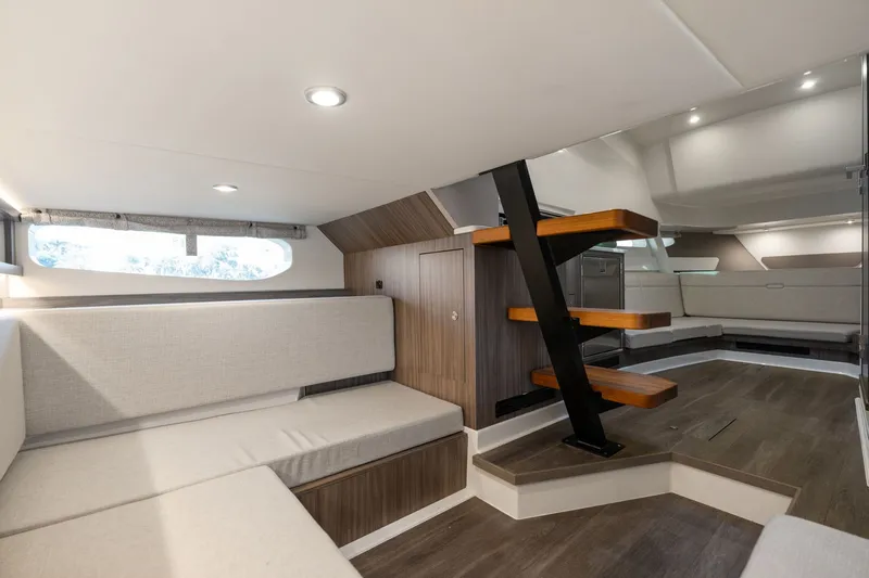  Yacht Photos Pics 2023 Sea Ray 370 Sundancer interior with modern seating and wooden accents.