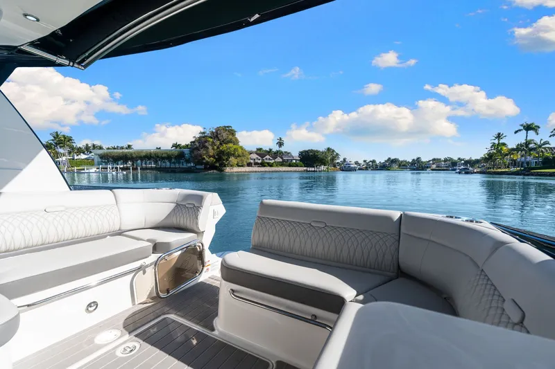  Yacht Photos Pics 2023 Sea Ray 370 Sundancer yacht interior with scenic waterfront view.