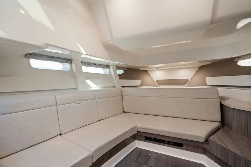  Yacht Photos Pics Interior of 2023 Sea Ray 370 Sundancer yacht with beige seating and modern design.