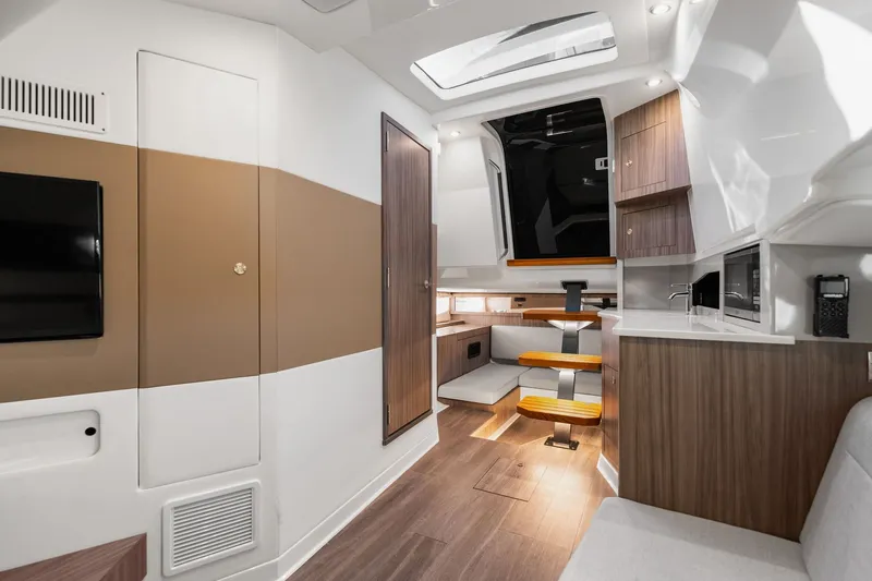  Yacht Photos Pics Luxurious interior of 2023 Sea Ray 370 Sundancer yacht with modern amenities and sleek design.