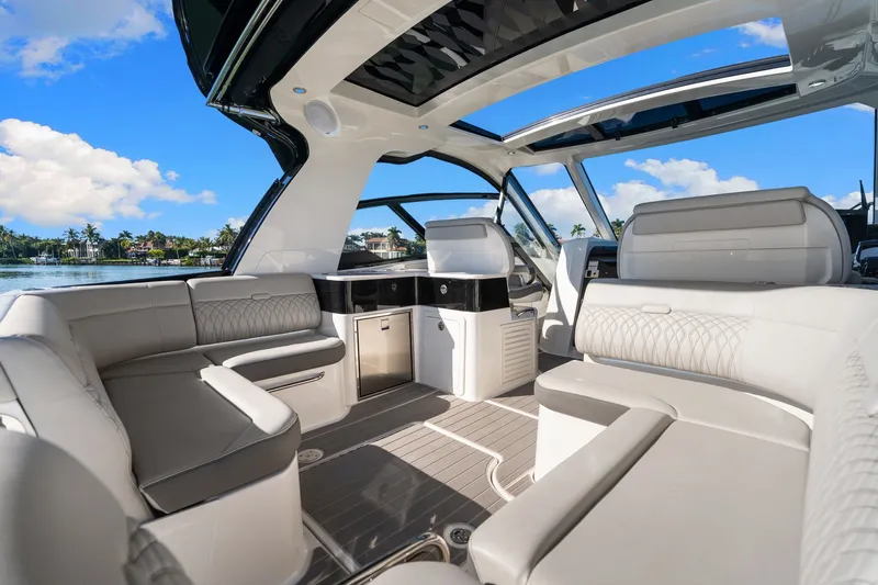  Yacht Photos Pics Luxurious interior of 2023 Sea Ray 370 Sundancer yacht with elegant seating and panoramic views.