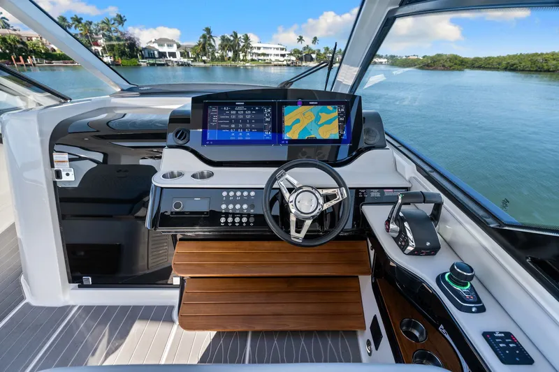 Yacht Photos Pics 2023 Sea Ray 370 Sundancer helm with modern navigation system and luxurious interior.