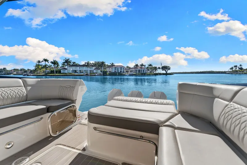  Yacht Photos Pics 2023 Sea Ray 370 Sundancer luxury yacht interior with scenic waterfront view.