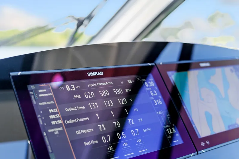  Yacht Photos Pics Simrad display on 2023 Sea Ray 370 Sundancer showing engine metrics and navigation.