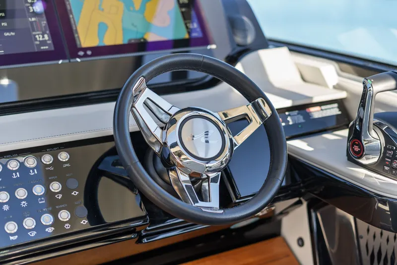  Yacht Photos Pics 2023 Sea Ray 370 Sundancer helm with modern steering wheel and control panel.