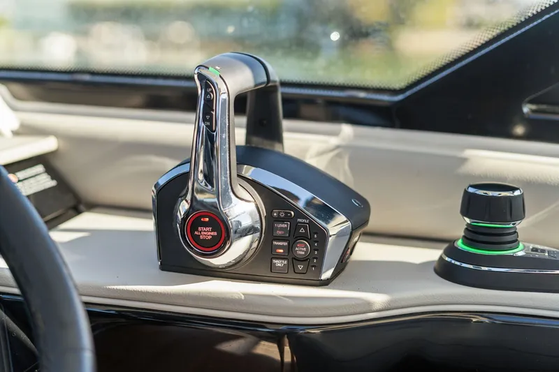  Yacht Photos Pics Control panel of 2023 Sea Ray 370 Sundancer boat, featuring start-stop button and joystick.