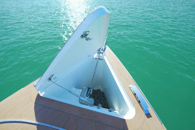  Yacht Photos Pics Open anchor compartment on 2018 Fjord 36 Xpress boat, floating on turquoise water.