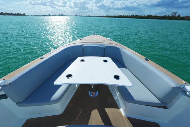  Yacht Photos Pics 2018 Fjord 36 Xpress boat interior with seating and table on calm water.