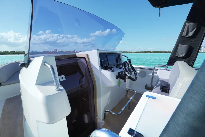  Yacht Photos Pics 2018 Fjord 36 Xpress boat cockpit with modern controls and ocean view.