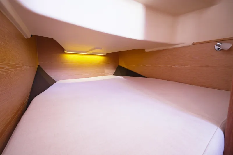  Yacht Photos Pics 2018 Fjord 36 Xpress cabin interior with cozy bed and ambient lighting.