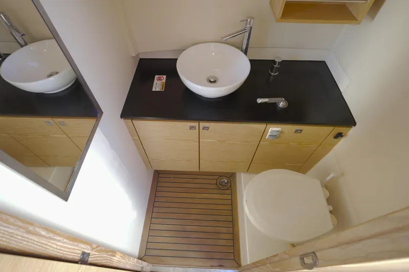  Yacht Photos Pics Modern bathroom in 2018 Fjord 36 Xpress yacht with sleek sink and wooden cabinetry.