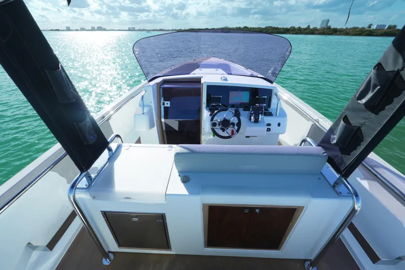  Yacht Photos Pics 2018 Fjord 36 Xpress boat helm with scenic ocean view.