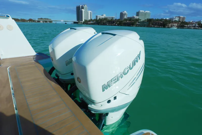  Yacht Photos Pics Twin Mercury outboard engines on a 2018 Fjord 36 Xpress, with city skyline in background.