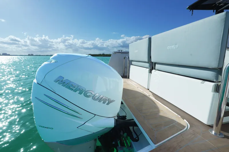  Yacht Photos Pics 2018 Fjord 36 Xpress boat with Mercury engine on turquoise water.