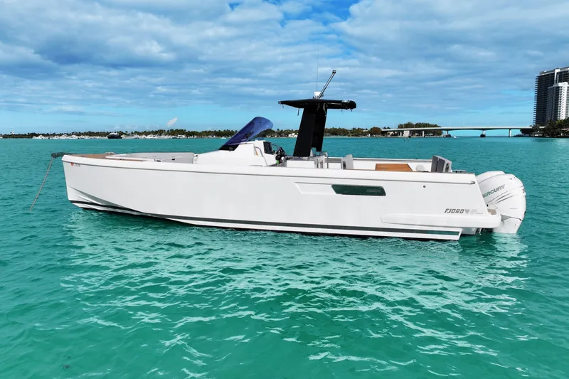  Yacht Photos Pics 2018 Fjord 36 Xpress boat on turquoise water, clear sky background.