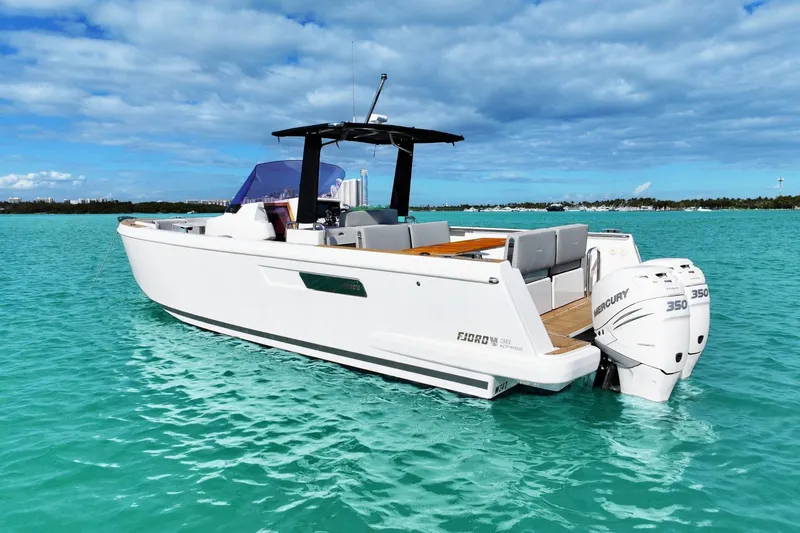  Yacht Photos Pics 2018 Fjord 36 Xpress boat on turquoise water with twin Mercury 350 engines.
