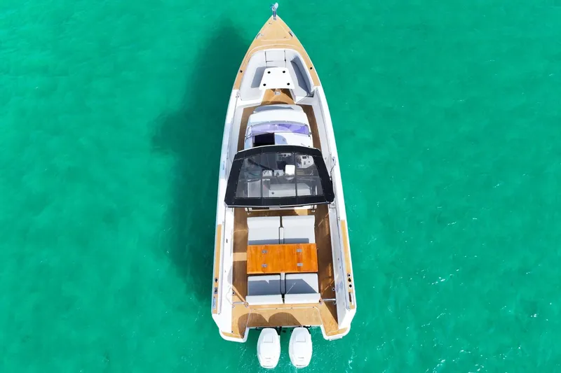  Yacht Photos Pics Aerial view of 2018 Fjord 36 Xpress boat on turquoise water.