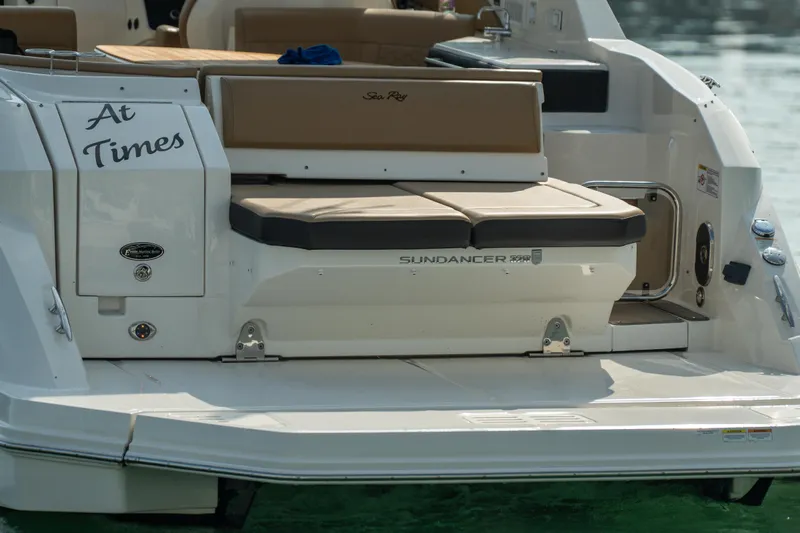 At Times Yacht Photos Pics 2019 Sea Ray Sundancer 320 boat stern with seating and "At Times" text.