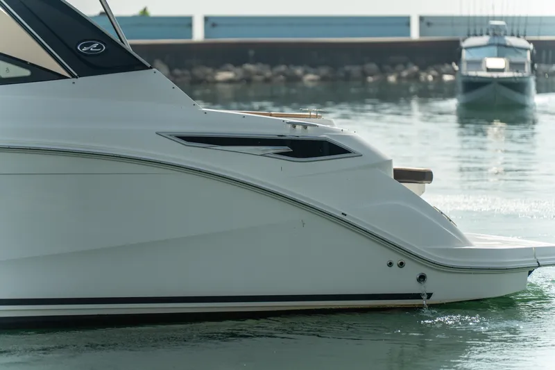 At Times Yacht Photos Pics 2019 Sea Ray Sundancer 320 yacht docked in calm waters.