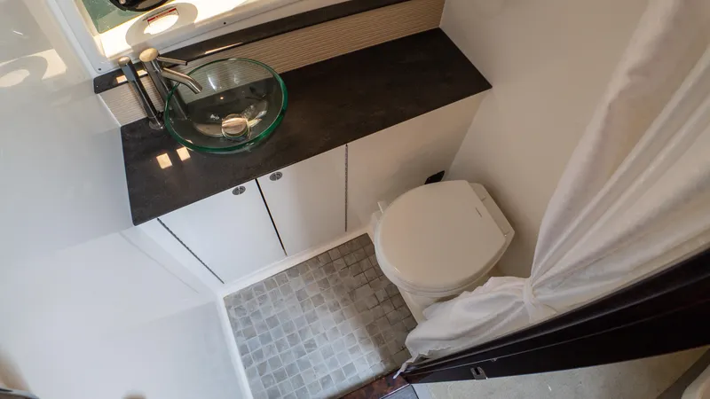 At Times Yacht Photos Pics 2019 Sea Ray Sundancer 320 bathroom with modern sink and compact toilet.