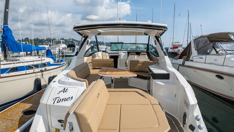 At Times Yacht Photos Pics 2019 Sea Ray Sundancer 320 yacht with spacious seating at marina.