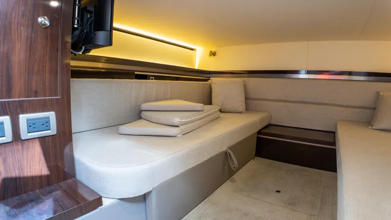 At Times Yacht Photos Pics Interior cabin of 2019 Sea Ray Sundancer 320 with beige seating and modern lighting.