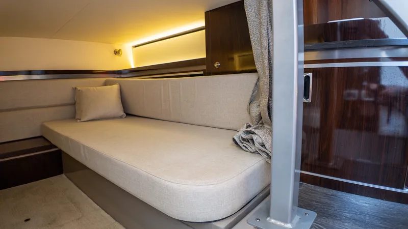 At Times Yacht Photos Pics Interior cabin of 2019 Sea Ray Sundancer 320 with beige seating and modern design.
