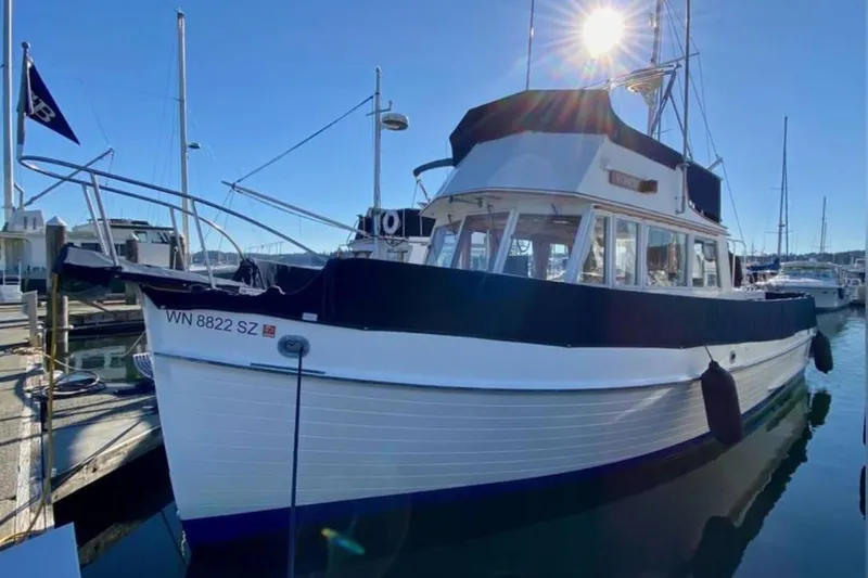 Yonder Yacht Photos Pics 1984 Grand Banks 36 Classic yacht docked in a sunny marina.