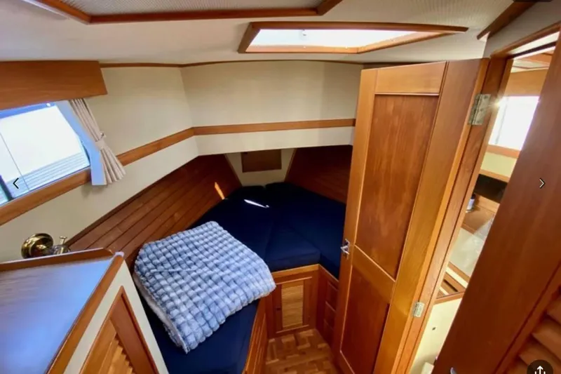 Yonder Yacht Photos Pics Cozy cabin interior of 1984 Grand Banks 36 Classic yacht with wooden finish.