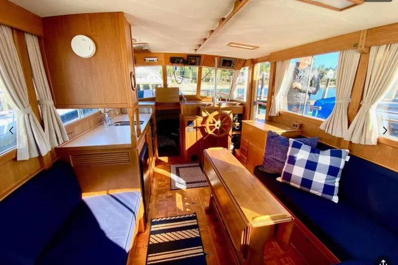 Yonder Yacht Photos Pics Interior of 1984 Grand Banks 36 Classic yacht with wooden furnishings and nautical decor.