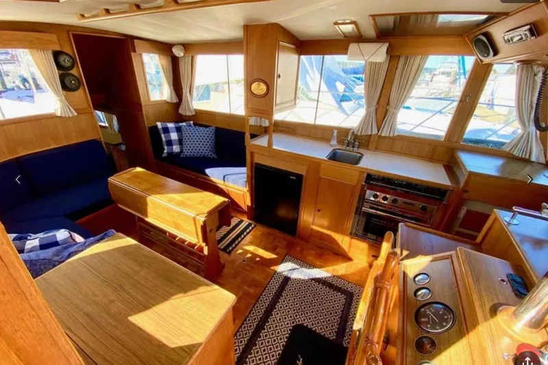 Yonder Yacht Photos Pics Interior of 1984 Grand Banks 36 Classic yacht with wood finish and cozy seating.