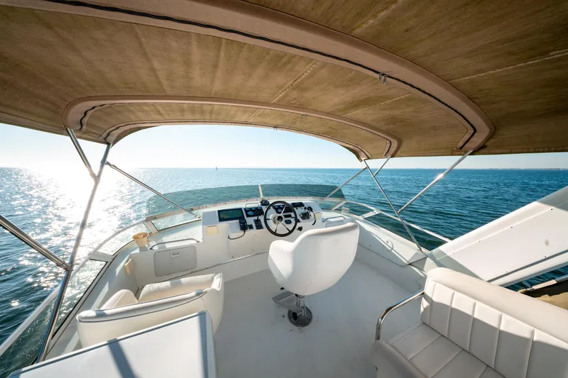  Yacht Photos Pics Cockpit view of 2003 Navigator 3900 yacht on open sea under sunny sky.