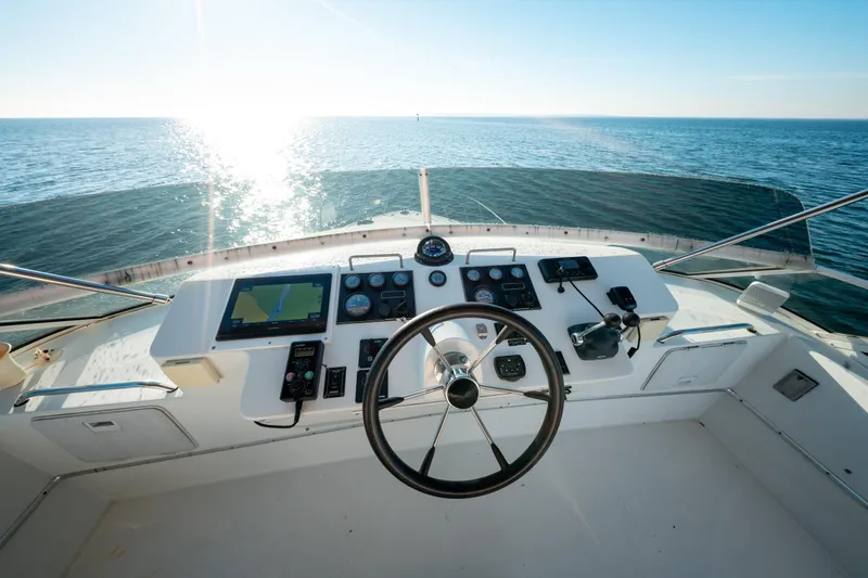  Yacht Photos Pics Helm of 2003 Navigator 3900 yacht with ocean view and navigational instruments.