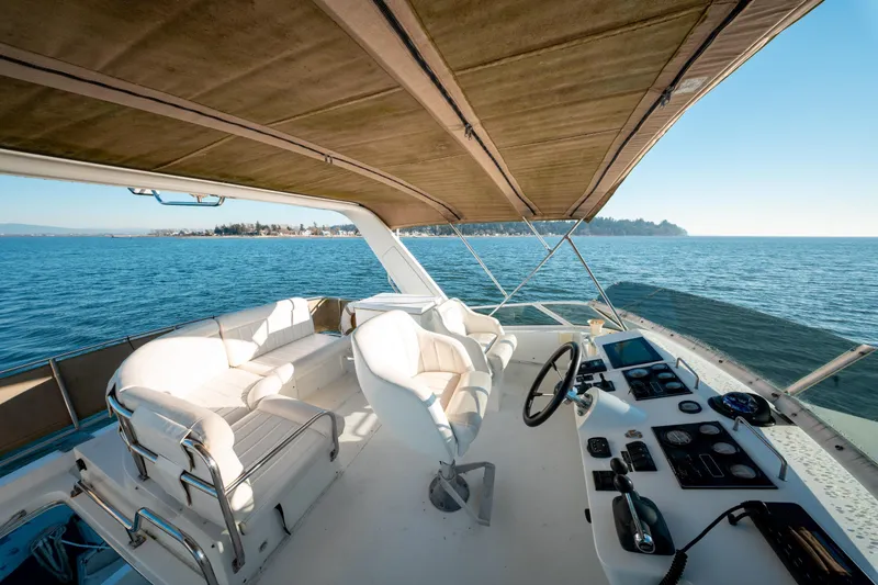  Yacht Photos Pics Luxurious 2003 Navigator 3900 yacht interior with helm, seating, and ocean view.