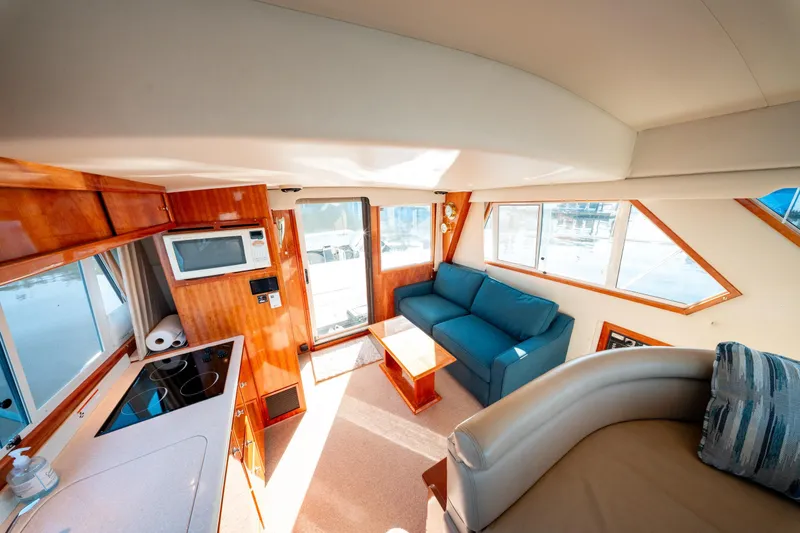  Yacht Photos Pics Luxurious interior of 2003 Navigator 3900 yacht with kitchen and seating area.