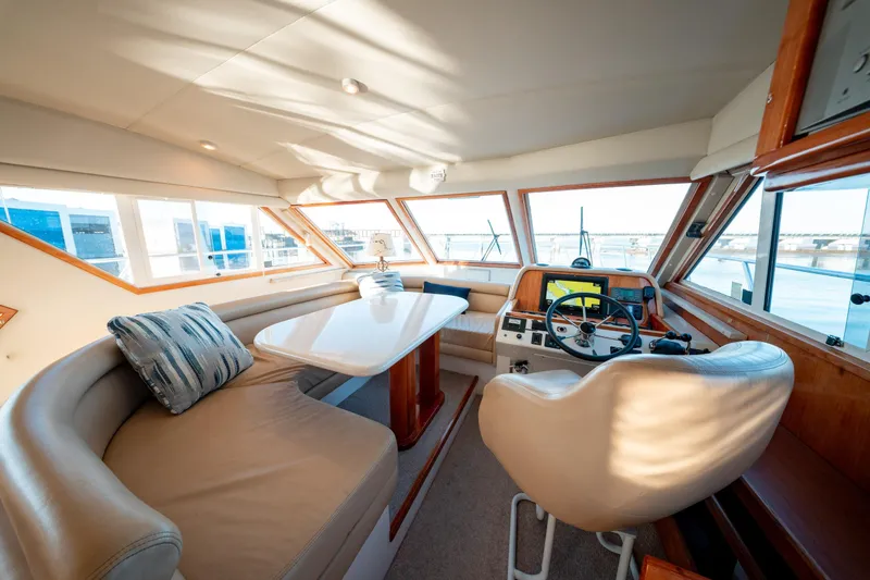  Yacht Photos Pics Luxurious 2003 Navigator 3900 yacht interior with helm, seating, and panoramic windows.