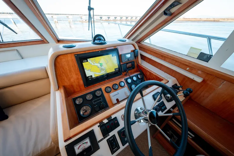  Yacht Photos Pics 2003 Navigator 3900 yacht helm with navigation system and steering wheel.