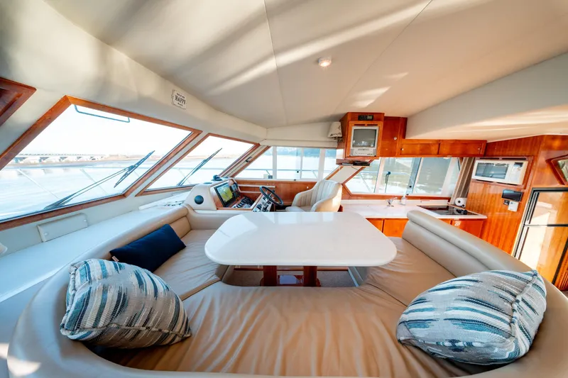  Yacht Photos Pics Luxurious interior of 2003 Navigator 3900 yacht with plush seating and modern amenities.